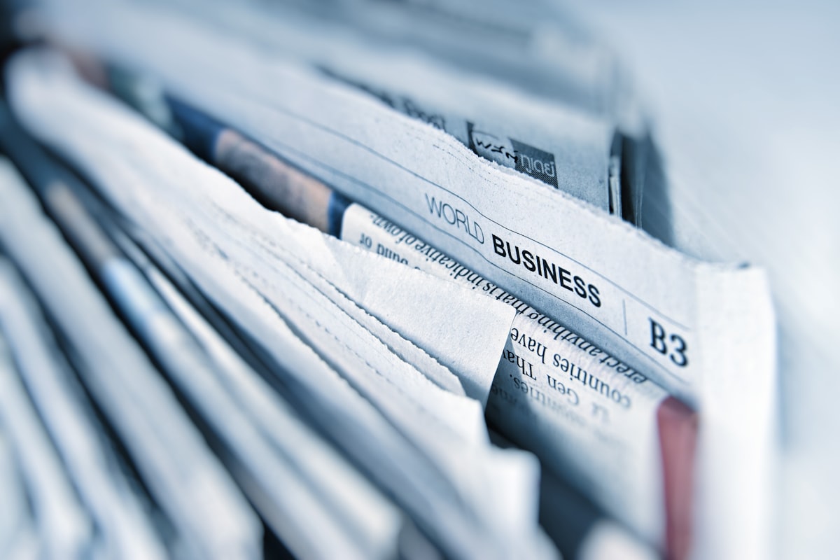 A close-up stack of folded newspapers